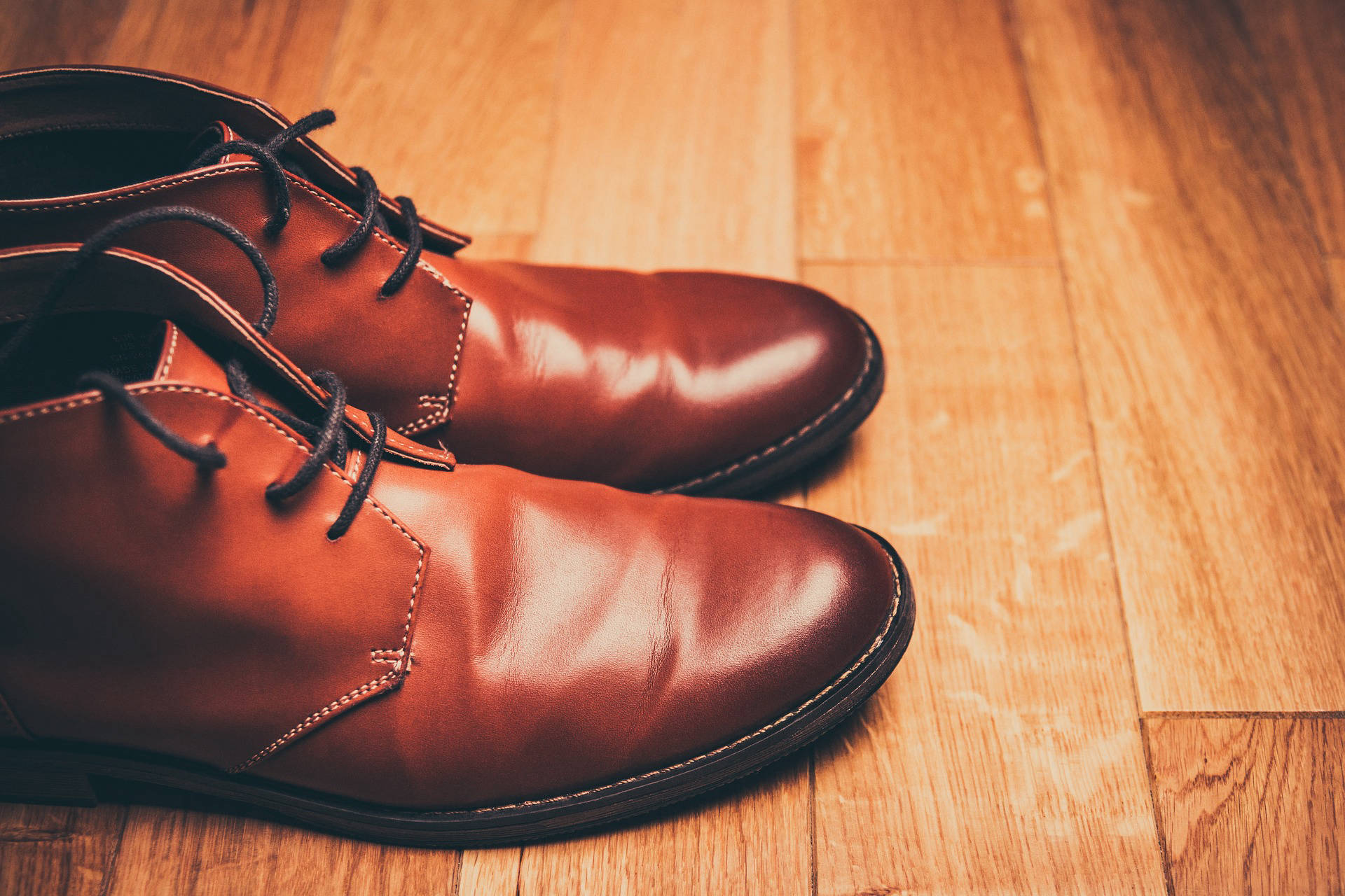 Close-up of classic brown leather shoes from the previous website material, representing Italian footwear heritage.